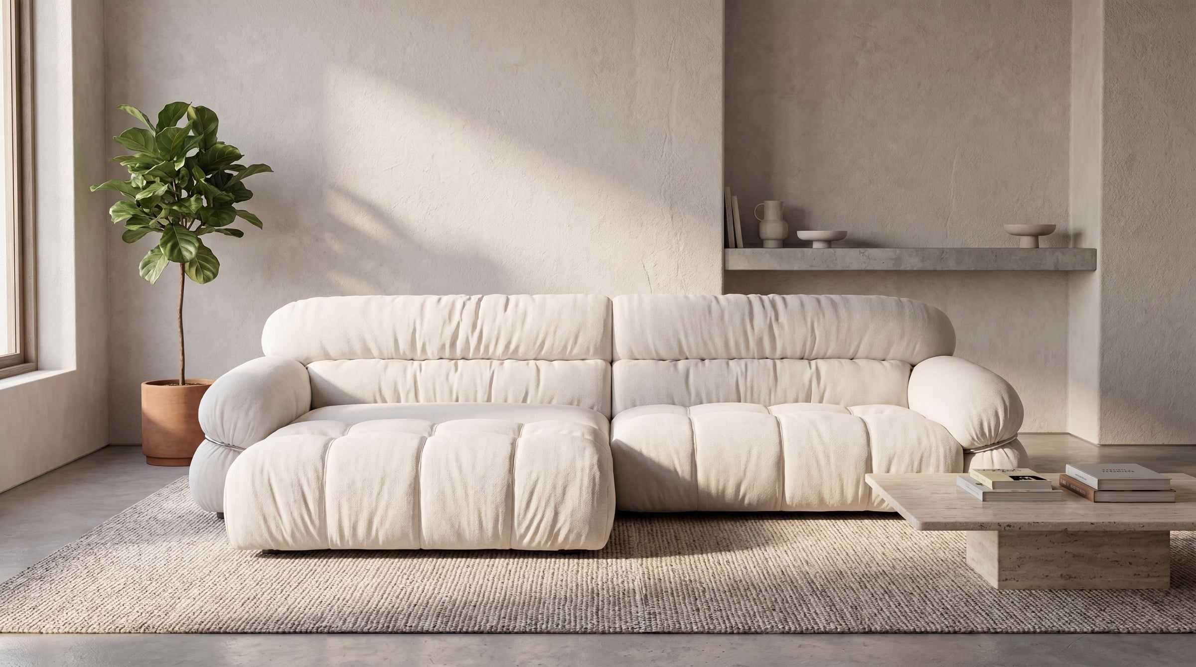 A cream L-shaped Tinoa sofa with a chaise in a sunlit living room