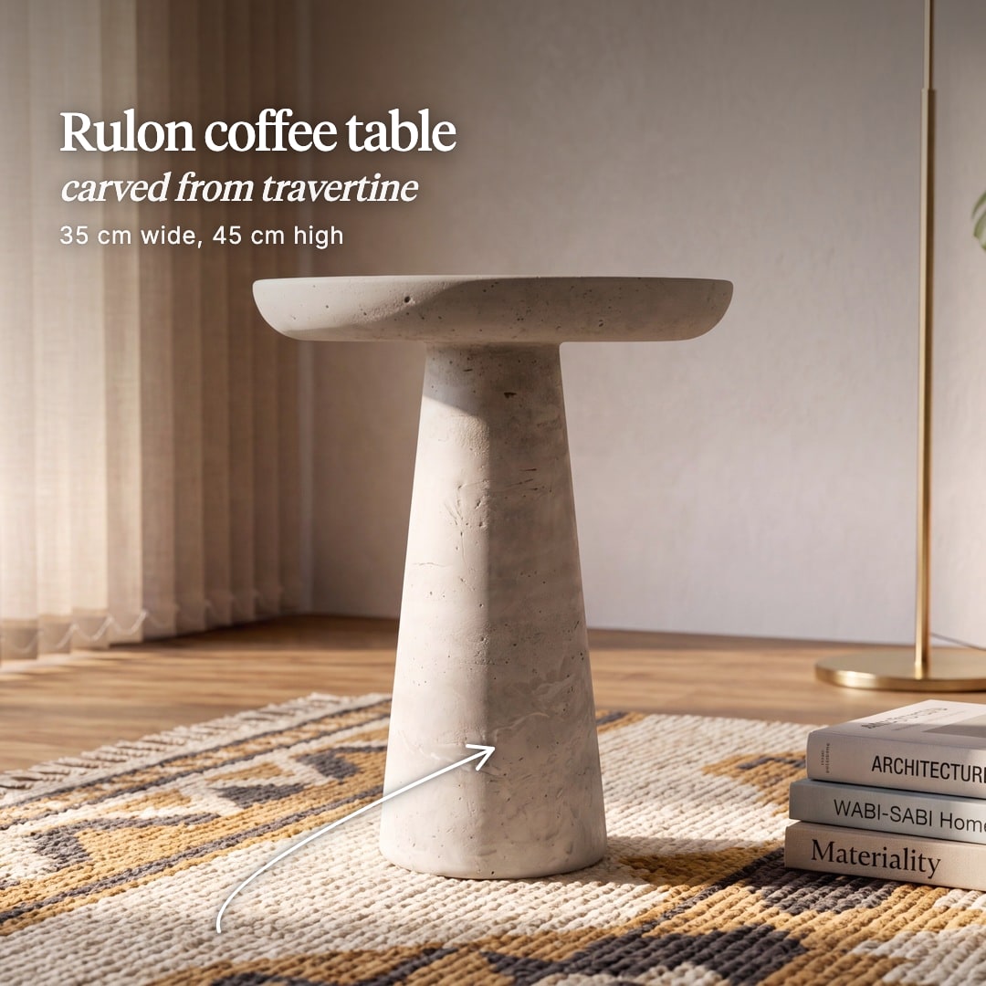 Rulon travertine table with a round dished top on a tapered pedestal. The image reads "Rulon coffee table, carved from travertine, 35 cm wide, 45 cm high".