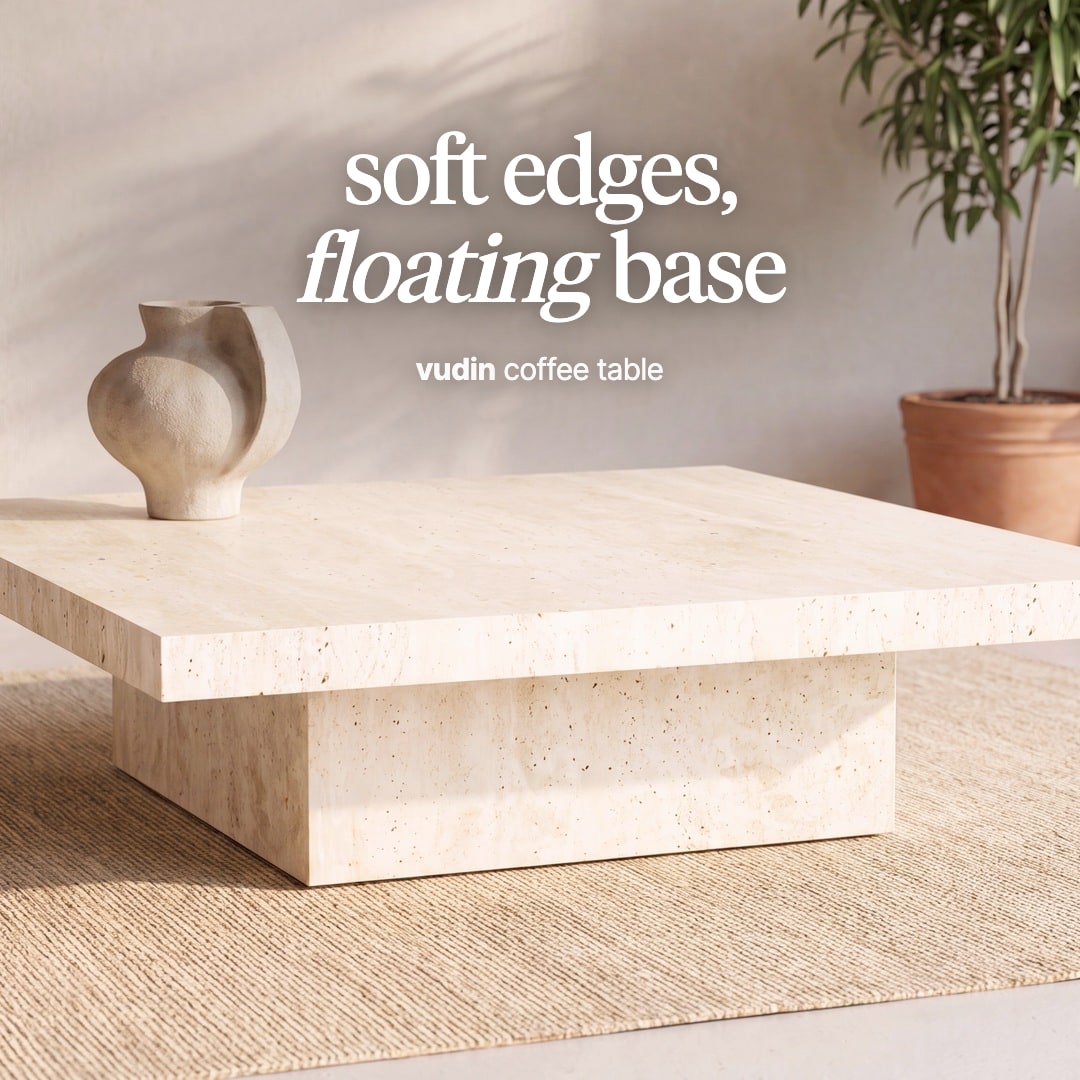 Vudin square travertine coffee table on a recessed base. The image reads "soft edges, floating base, vudin coffee table".