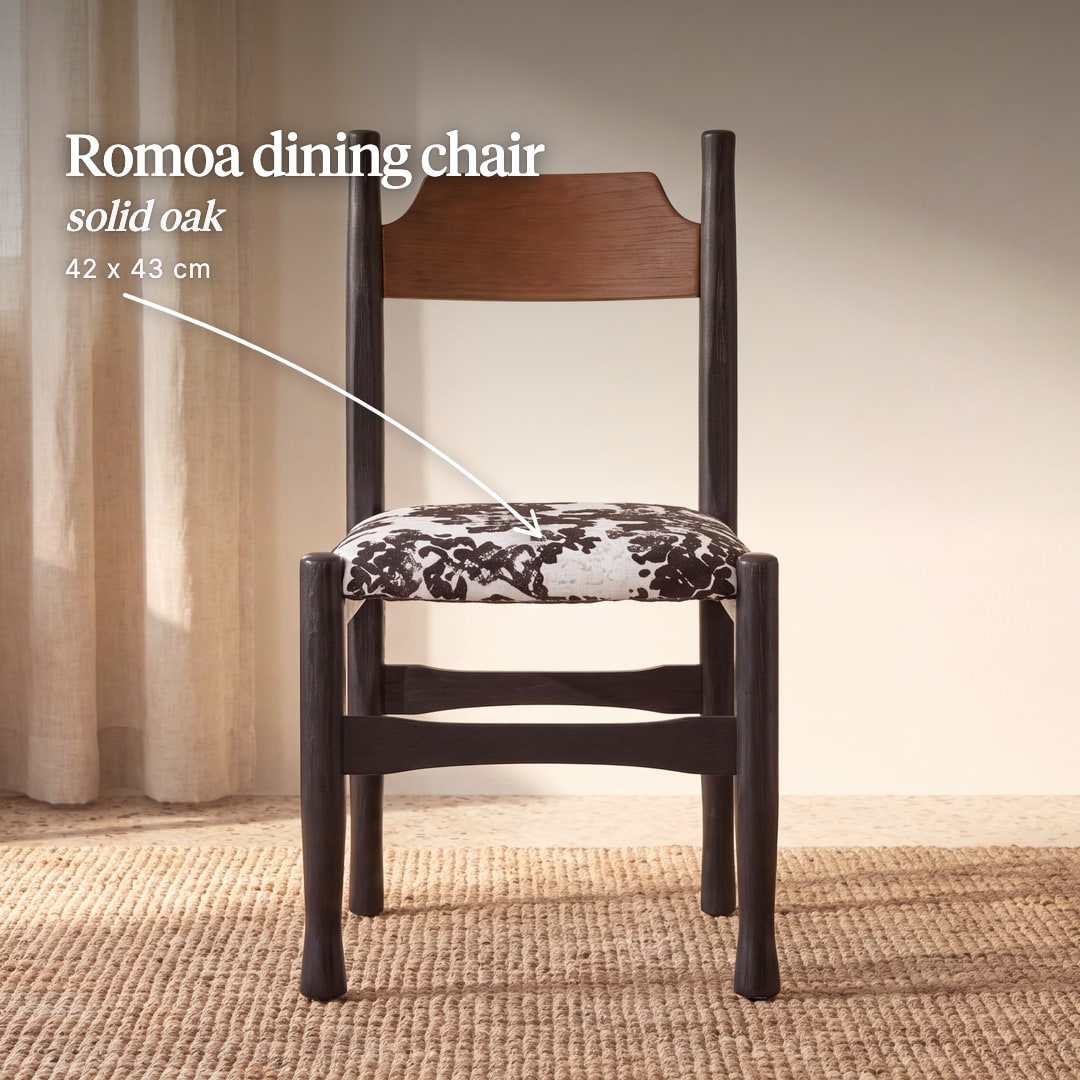 Romoa dining chair with a dark oak frame, a wooden back rail and a black and white patterned seat. The image reads "Romoa dining chair, solid oak, 42 x 43 cm".