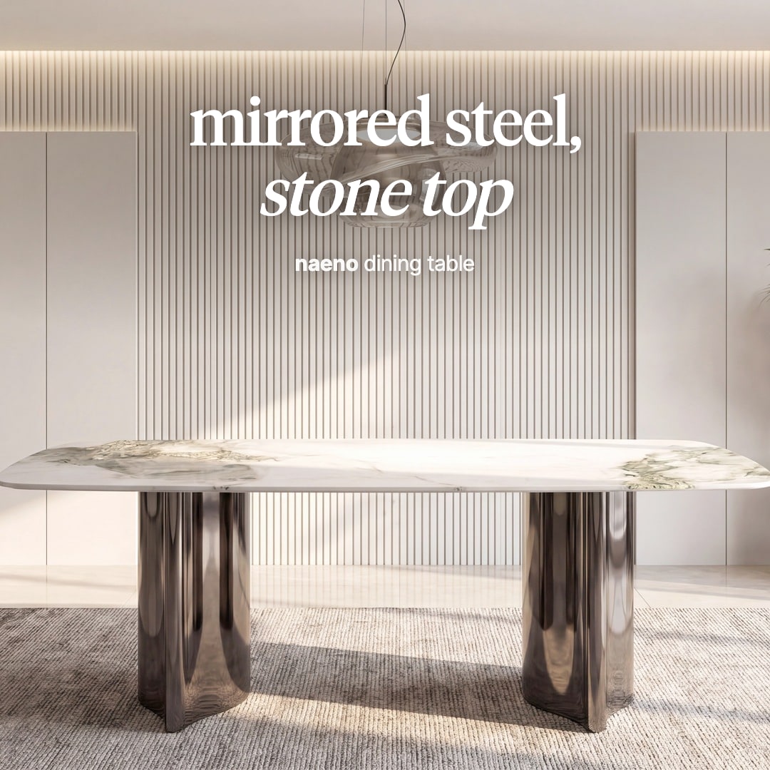 Naeno dining table with a white veined stone top on two mirrored steel pedestals. The image reads "mirrored steel, stone top, naeno dining table".