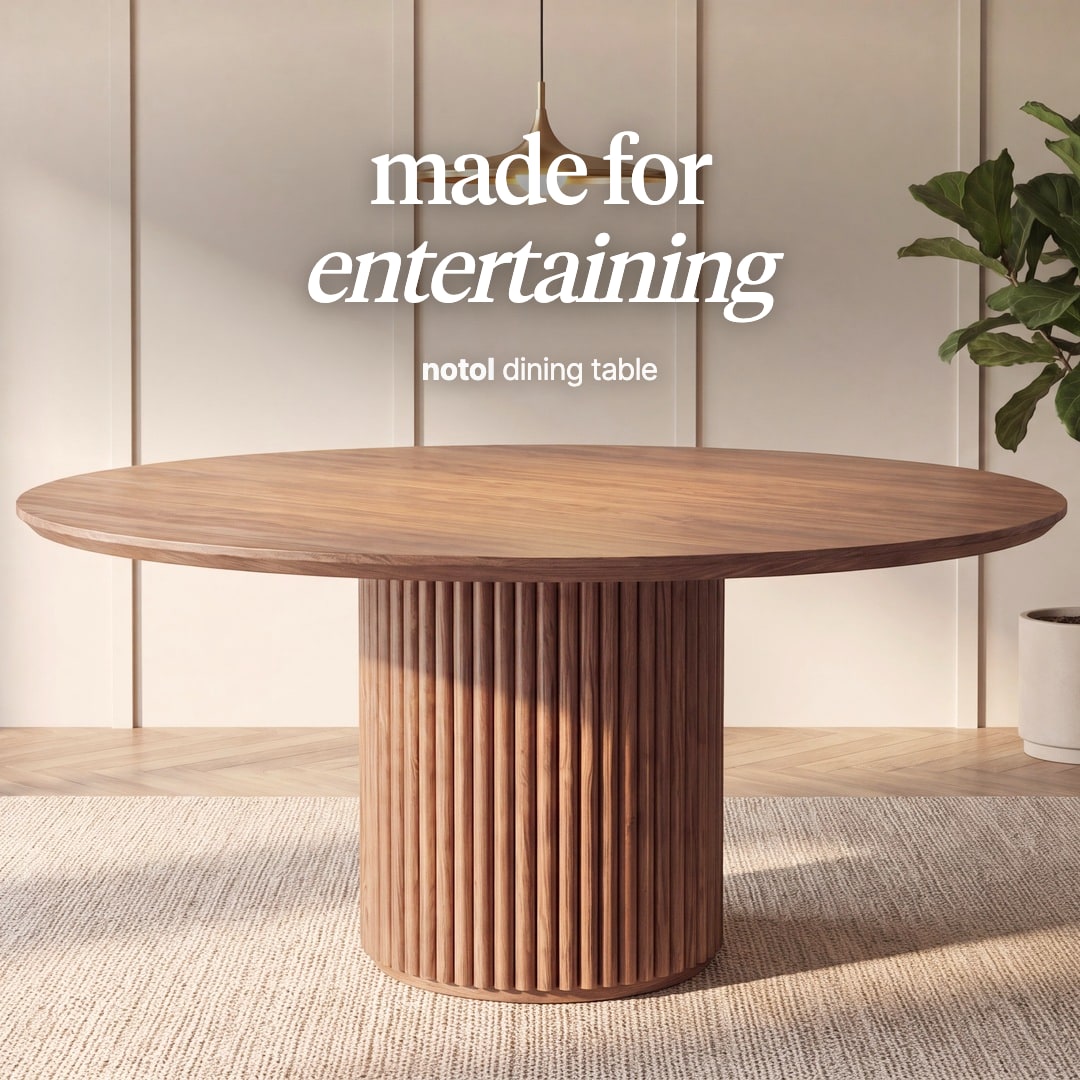 Notol round dining table in walnut on a fluted pedestal. The image reads "made for entertaining, notol dining table".