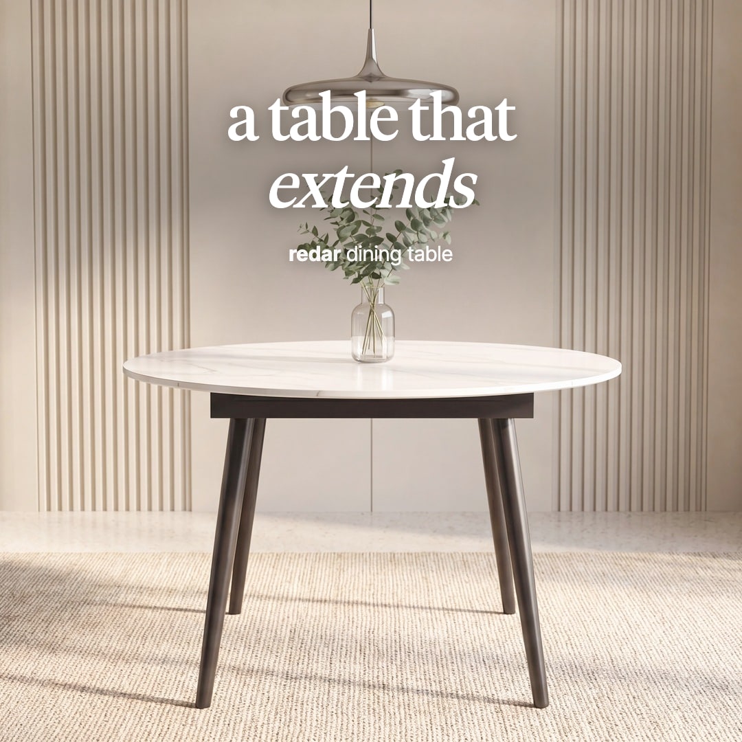 Redar round dining table with a white top on dark tapered legs. The image reads "a table that extends, redar dining table".