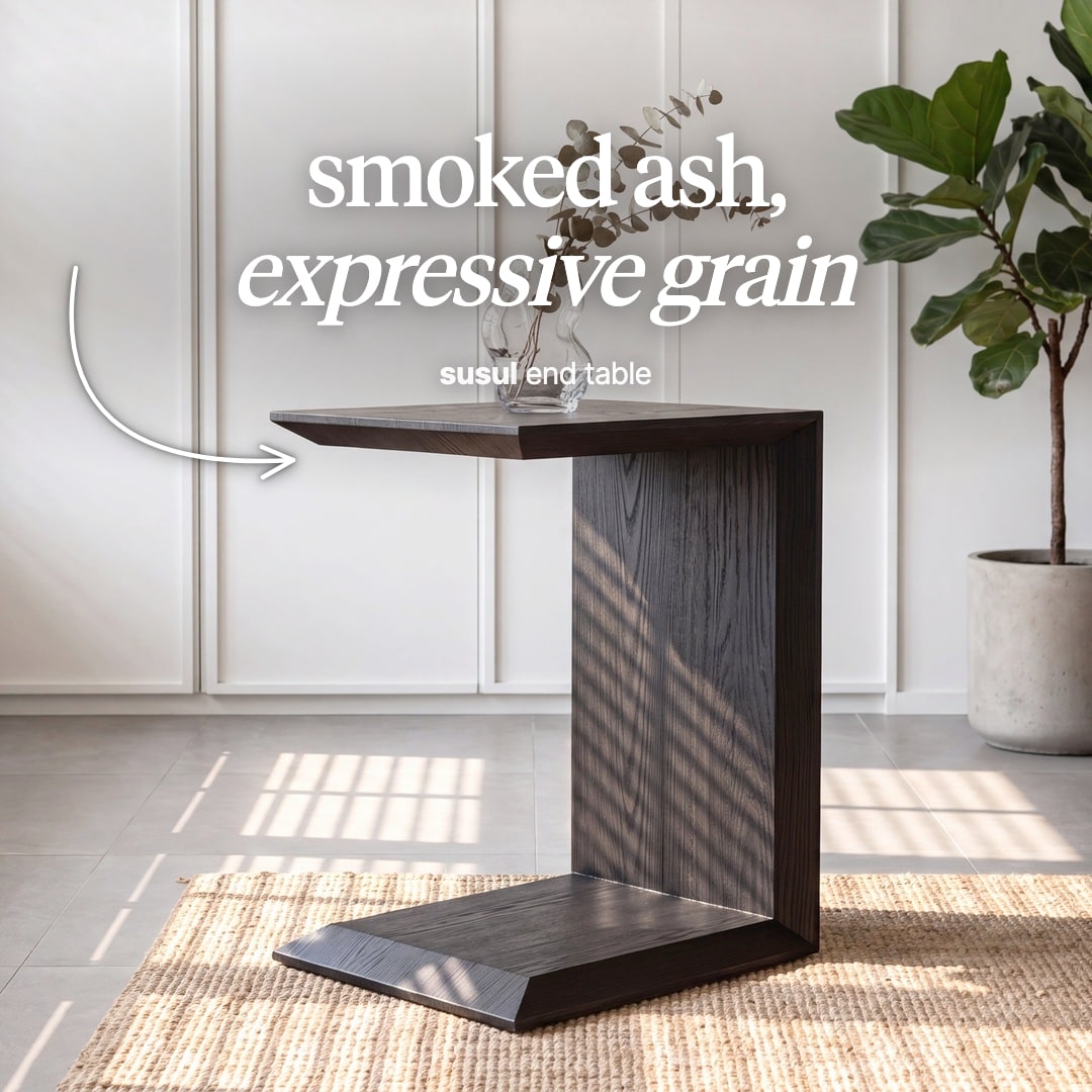Susul C-shaped side table in smoked ash. The image reads "smoked ash, expressive grain, susul end table".