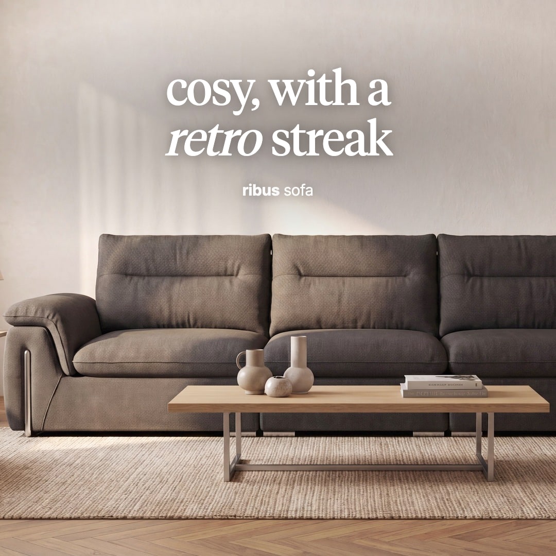 Ribus sofa in a warm grey-brown fabric behind a light wood coffee table. The image reads "cosy, with a retro streak, ribus sofa".