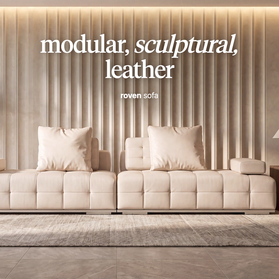 Roven modular sofa in cream leather with block cushions, against a fluted wall. The image reads "modular, sculptural, leather, roven sofa".