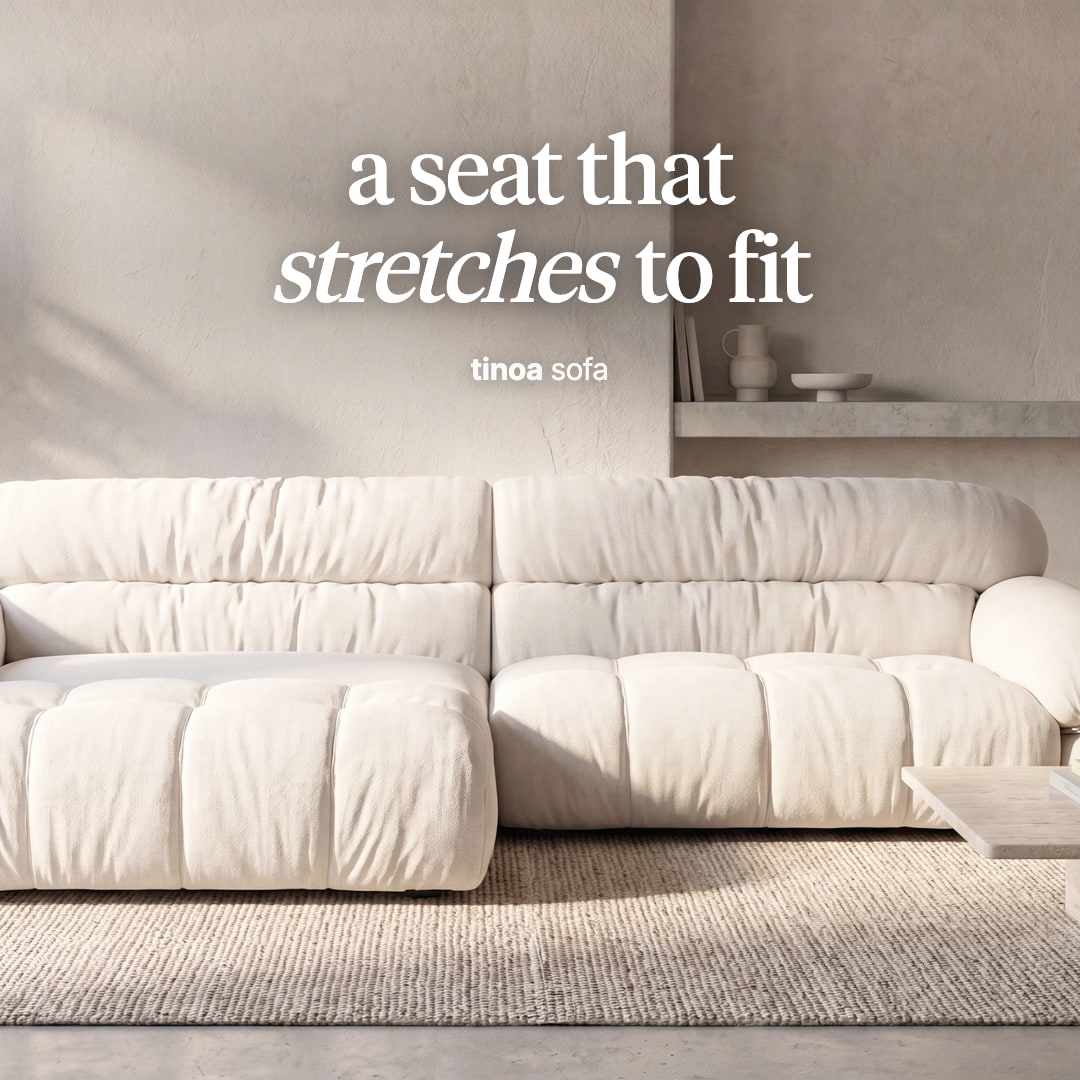 Tinoa sofa in cream fabric with its left seat extended forward. The image reads "a seat that stretches to fit, tinoa sofa".