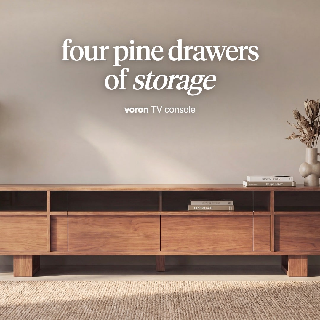 Voron TV console in a warm teak tone with open shelves above the drawer fronts. The image reads "four pine drawers of storage, voron TV console".